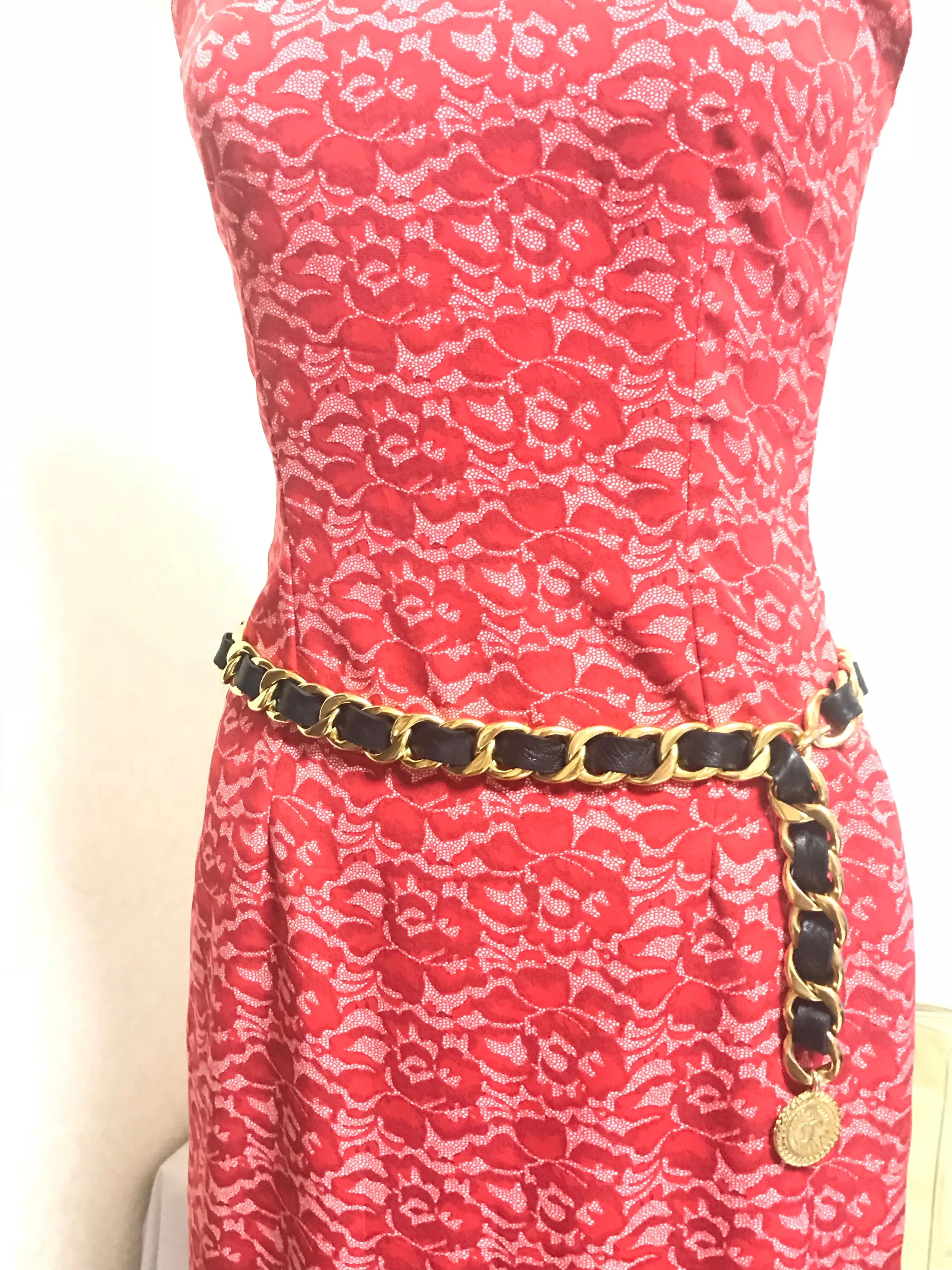 1980s Vintage CHANEL black leather thick chain belt with golden CC and mademoiselle charm. Nice and heavy single layer belt from CHANEL.
