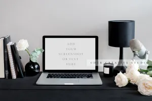 Laptop and Desk Accessories on Black Desk
