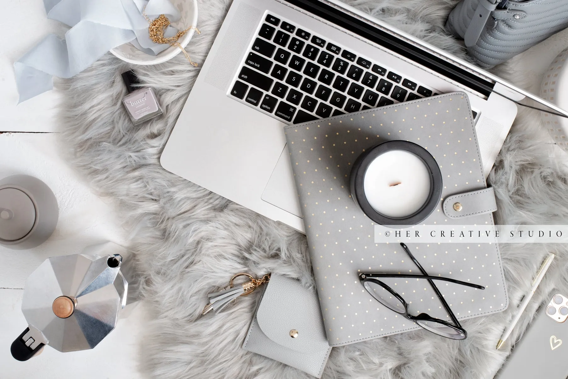 Laptop, Notebook & Candle on Grey Workspace. Stock Image
