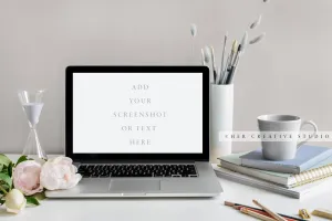 Laptop with Grey and Gold Desk Accessories. Stock Image