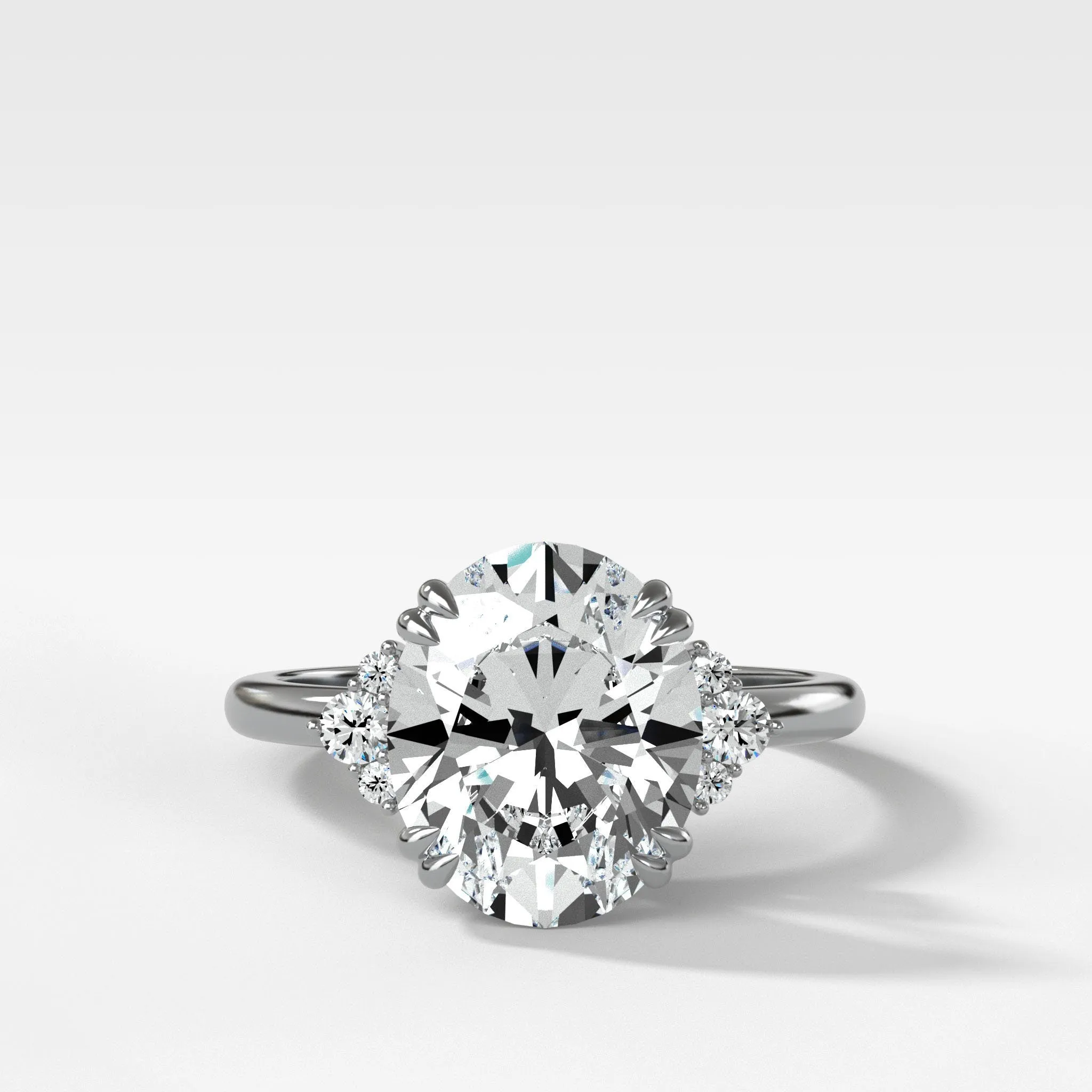 Signature Cluster Engagement Ring With Oval Cut Diamond