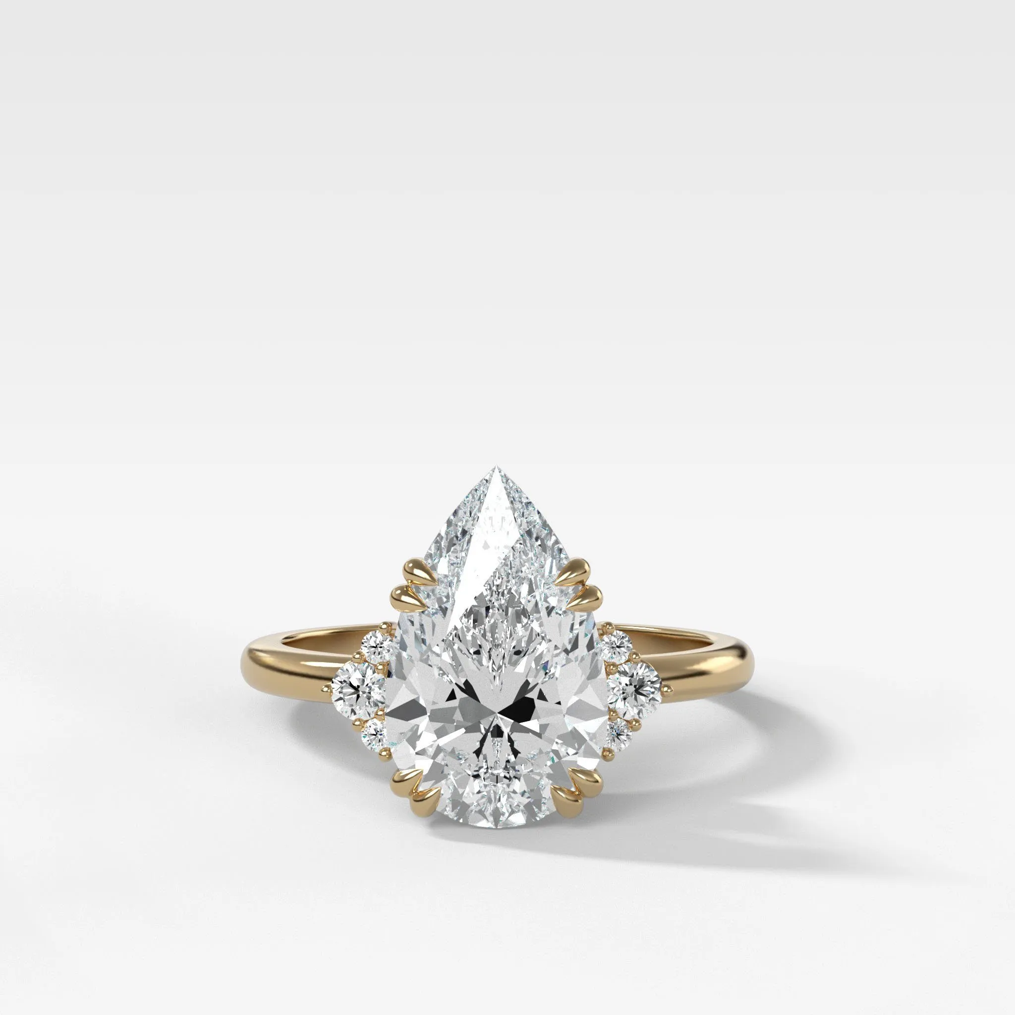 Signature Cluster Engagement Ring With Pear Cut Diamond