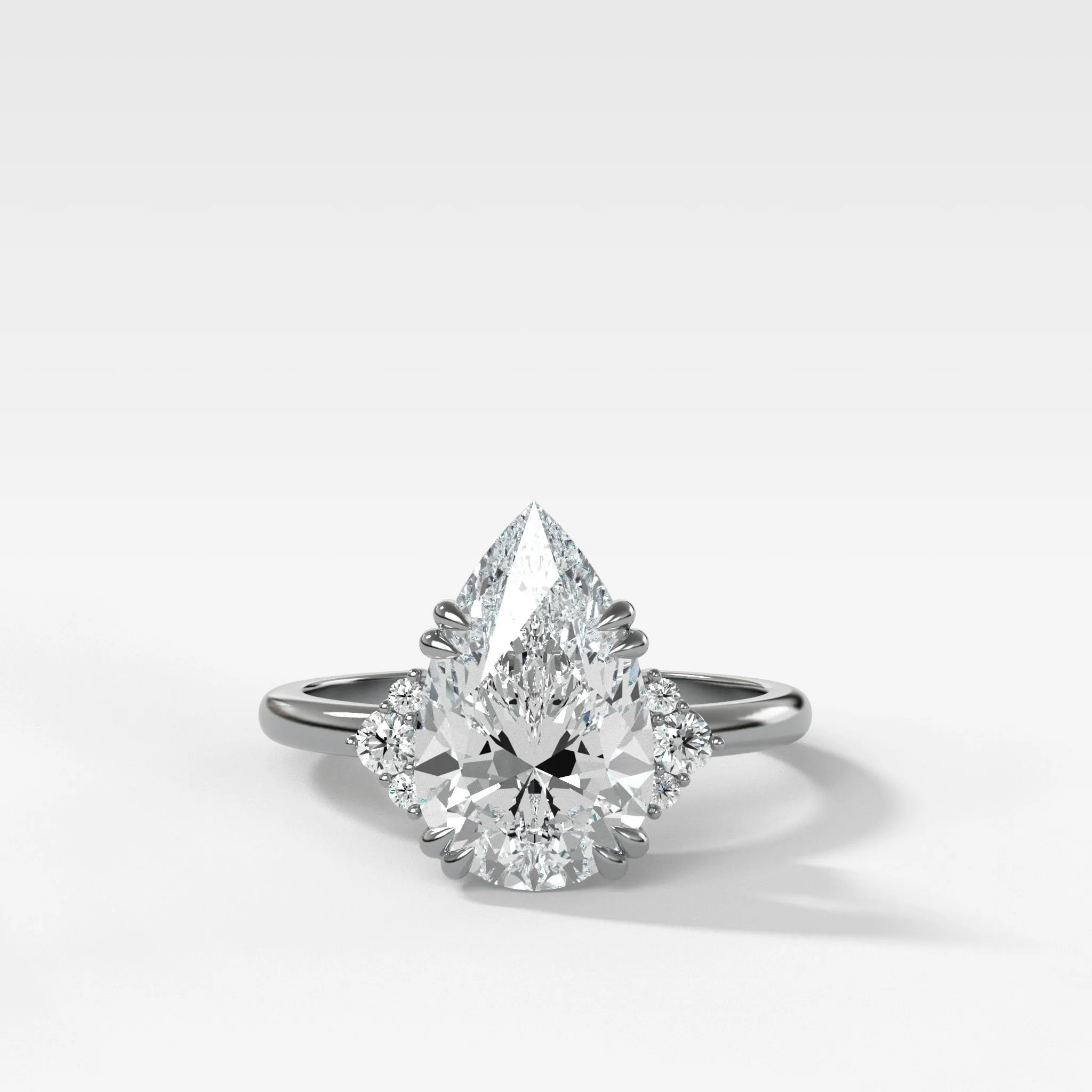 Signature Cluster Engagement Ring With Pear Cut Diamond